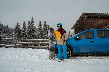 Man in ski equipment, wearing safety glasses. Looking for powder to freeride