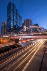 Fototapeta na wymiar Chong Nonsi Bridge. Architectures in smart city for technology background. Skyscraper buildings in Bangkok City at night, Thailand
