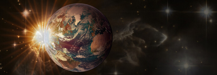 Sunrise with lens flare. Beautiful planet Earth in space in sun rays with copy space, panoramic view. Elements of this image furnished by NASA.
