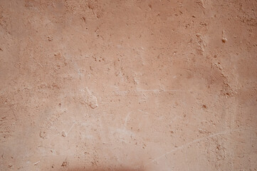 An ancient method of plastering with clay. Old clay wall. Last century. Old plaster background.