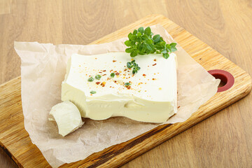 Greek Feta cheese over board