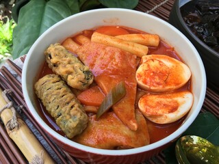 Spicy sausage tokpokki with Eo Muk Guk Korean Fish Cake Soup
 with boiled egg and black sauce noodle