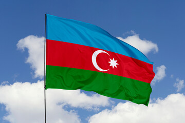 Azerbaijan flag isolated on the blue sky background. close up waving flag of Azerbaijan. flag symbols of Azerbaijan. Concept of Azerbaijan.