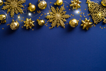 Elegant Blue Christmas background with golden balls and decorations. Christmas holiday celebration, winter, New Year concept. Christmas banner mockup, greeting card template