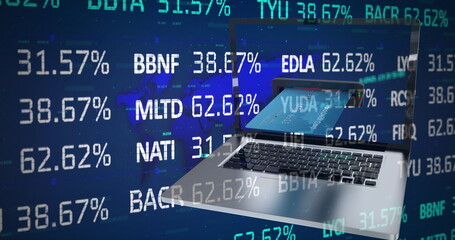 Image of financial data processing over credit card inserted into laptop