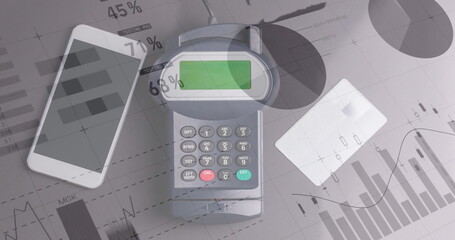 Image of financial data processing over credit card terminal smartphone and credit card