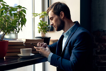 business man in a suit of a cafe official talking to the phone