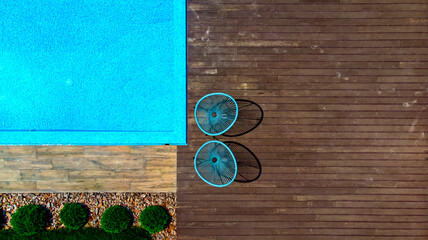 Aerial. Swimming pool fragment in landscape design. Top view from drone.