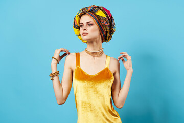 woman in multicolored turban luxury ethnicity blue background