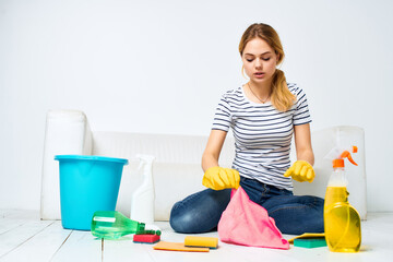 woman at home cleaning detergent in the room
