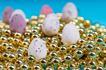 simple eggs are located among the golden balls.