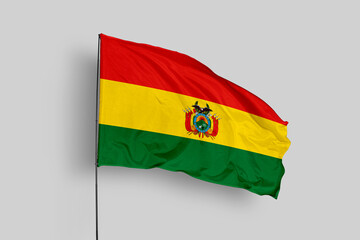 Bolivia flag isolated on the blue sky background. close up waving flag of Bolivia. flag symbols of Bolivia. Concept of Bolivia.