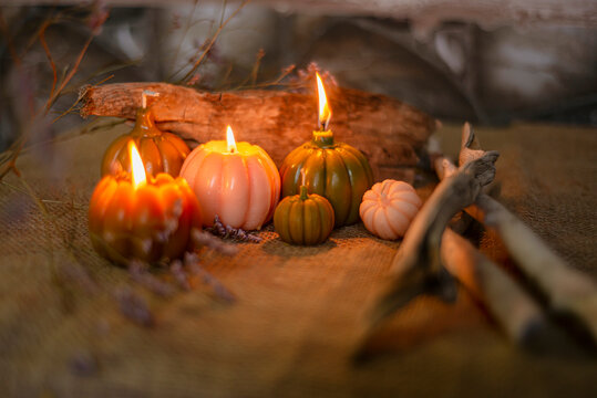 Candles With The Shape Of Pumpkins For Halloween, White, Golden Pumpkins And Lighted Candles, Magic Atmosphere Of A Romantic Evening, Halloween Concept