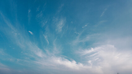 Blue sky and clouds at sunset background