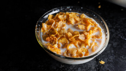 A bowl of corn flakes in the milk.