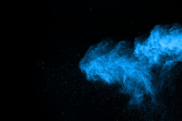 abstract blue powder splatted background,Freeze motion of color powder exploding/throwing color powder,color glitter texture on black background.