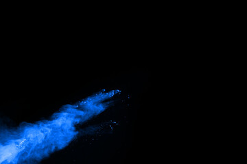abstract blue powder splatted background,Freeze motion of color powder exploding/throwing color powder,color glitter texture on black background.