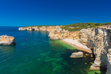 Obraz premium Aerial views of Praia da Marinha and Malhada do Baraco - beaches in Algarve, Portugal