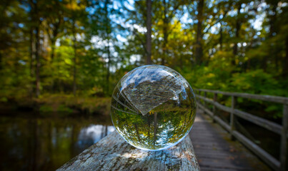 glass ball on old wooden bidge