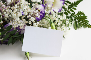 greeting card design. bouquet of flowers and white blank for text 