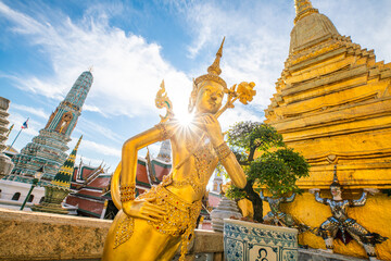 Golden giant angel statue stand in temple of emerald buddha