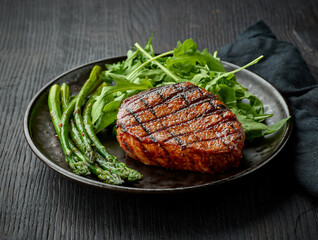 Freshly cooked veal steak with sides on plate