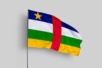 Central African flag isolated on the blue sky background. close up waving flag of Central African. flag symbols of Central African. Concept of Central African.