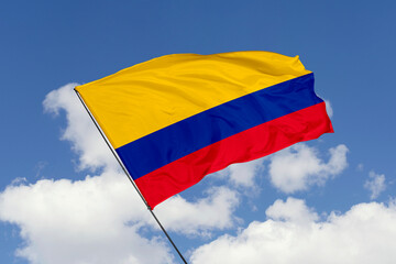 Colombia flag isolated on the blue sky background. close up waving flag of Colombia. flag symbols of Colombia. Concept of Colombia.