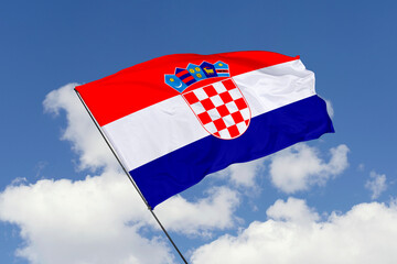 Croatia flag isolated on the blue sky background. close up waving flag of Croatia. flag symbols of Croatia. Concept of Croatia.