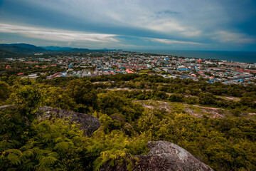 The view of the natural background of the mountain close-up, with blurred fog scattered in the rainy season or the humid climate, with beautiful green trees in the ecological system