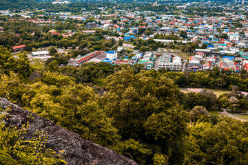 Obraz premium The view of the natural background of the mountain close-up, with blurred fog scattered in the rainy season or the humid climate, with beautiful green trees in the ecological system