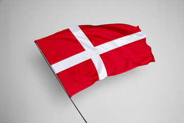 Denmark flag isolated on white background. close up waving flag of Denmark. flag symbols of Denmark. Concept of Denmark.