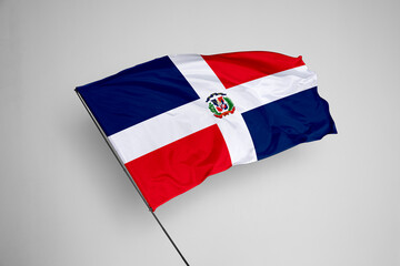 Dominican Republic flag isolated on white background. close up waving flag of Dominican Republic. flag symbols of Dominican Republic. Concept of Dominican Republic.
