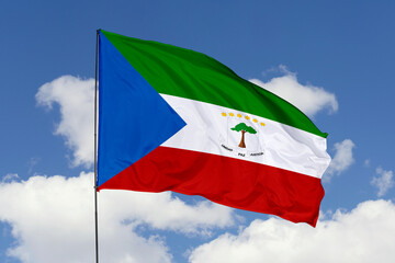 Equatorial Guinea flag isolated on the blue sky background. close up waving flag of Equatorial Guinea. flag symbols of Equatorial Guinea. Concept of Equatorial Guinea.