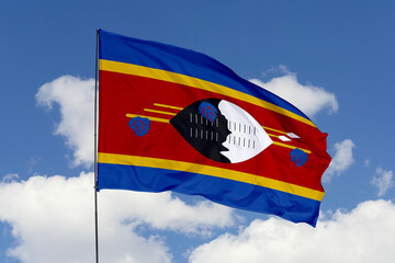 Swaziland flag isolated on the blue sky background. close up waving flag of Swaziland. flag symbols of Swaziland. Concept of Swaziland.