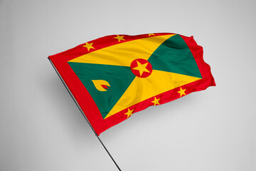 Grenada flag isolated on white background. close up waving flag of Grenada. flag symbols of Grenada. Concept of Grenada.