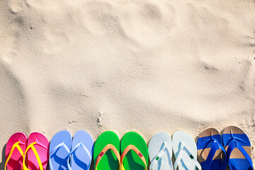 Stylish flip flops on beach, flat lay. Space for text - obrazy, fototapety, plakaty