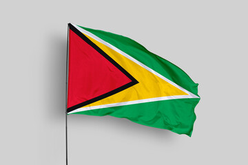 Guyana flag isolated on the blue sky background. close up waving flag of Guyana. flag symbols of Guyana. Concept of Guyana.