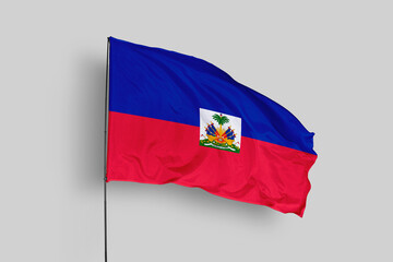 Haiti flag isolated on the blue sky background. close up waving flag of Haiti. flag symbols of Haiti. Concept of Haiti.