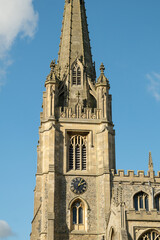Top part of cathedral bell tower with Gothic architecture at Saffron Walden, England