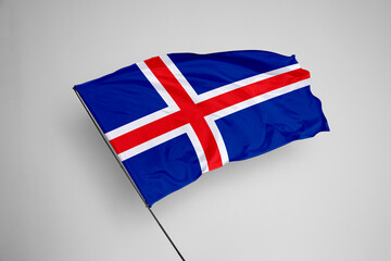 Obraz premium Iceland flag isolated on white background. close up waving flag of Iceland. flag symbols of Iceland. Concept of Iceland.