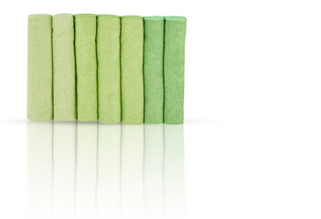 towels are folded together in layers isolated on white background with cut out have clipping path