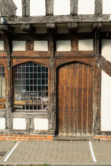 Medieval arched wooden gate at Tudor timber framed pub at Saffron Walden, England