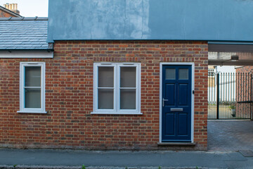 Traditional british brick house with blue door at Saffron Walden, England