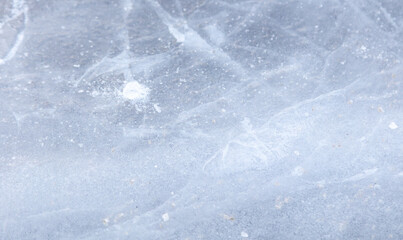 Crushed ice in a puddle as an abstract background.