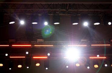 Spotlights at a concert at night.