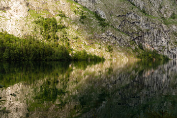 Fototapeta na wymiar Symmetrical mountain reflection on a still, serene lake, Obersee Germany
