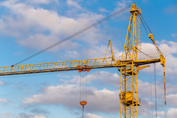 Tower cranes with hydraulic boom lift. Tower cranes on the construction of a new residential building.