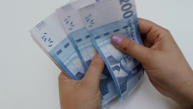 Counting Moroccan Dirham banknotes. Moroccan monetary background footage.