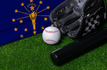 Baseball bat, glove and ball near Indiana flag on green grass background